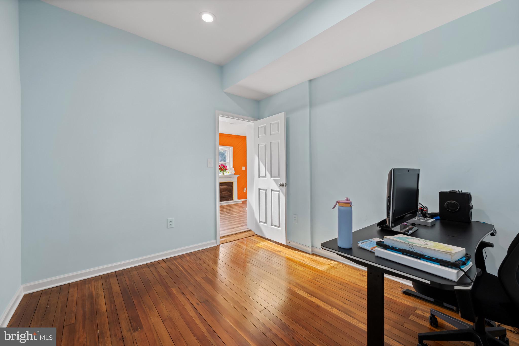 113 West Edgevale Road Baltimore, MD 21225 - Photo 16 of 41 a view of a workspace with furniture and wooden floor