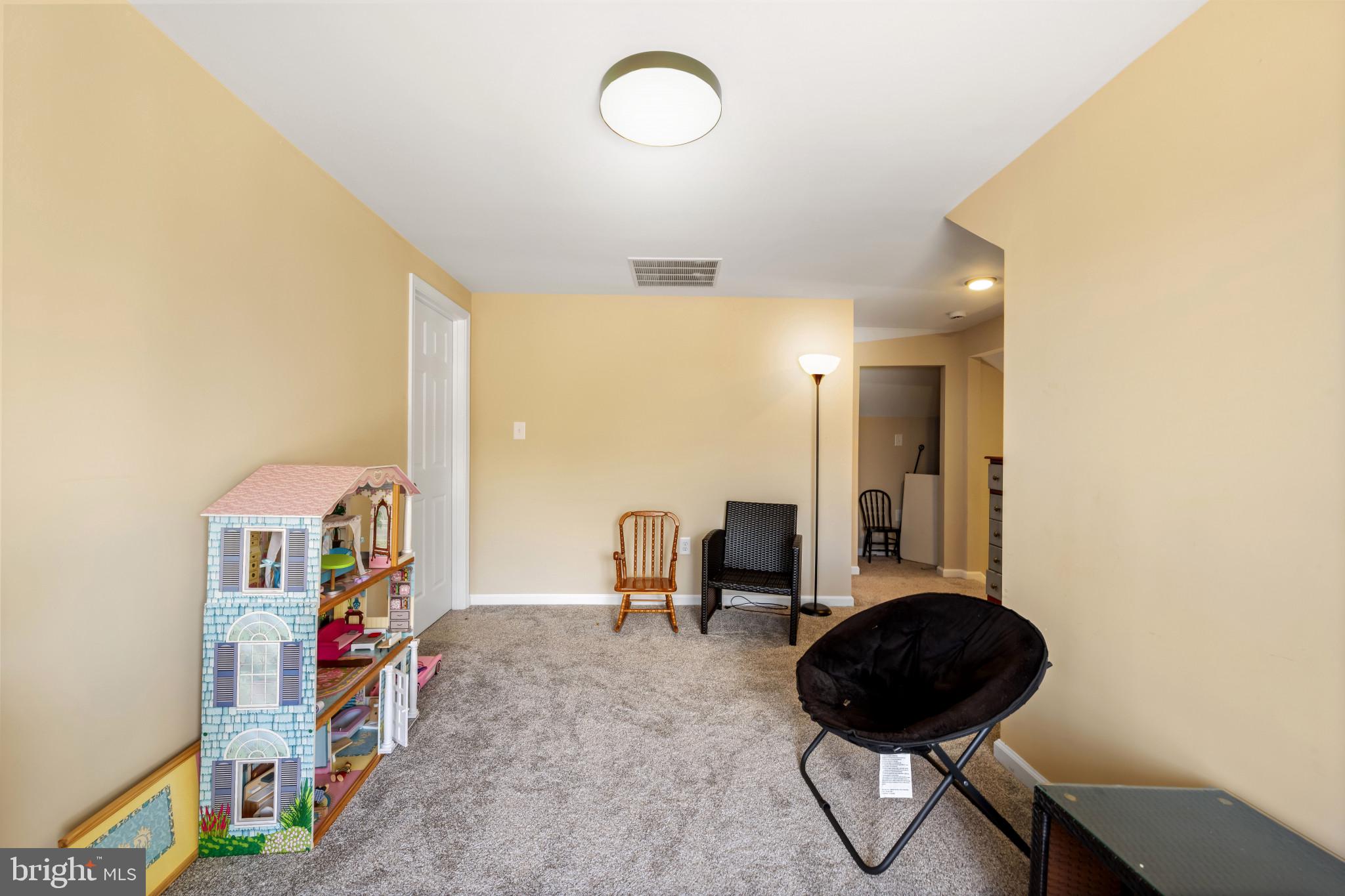 113 West Edgevale Road Baltimore, MD 21225 - Photo 21 of 41 a living room with furniture and a book shelf