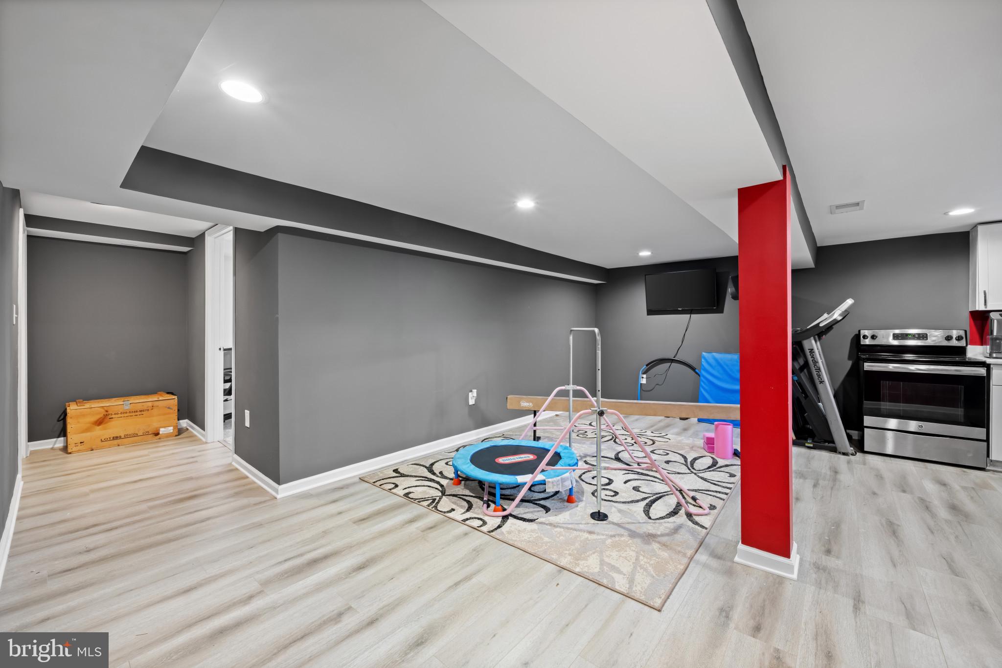 113 West Edgevale Road Baltimore, MD 21225 - Photo 31 of 41 a bedroom with a bed and a couch