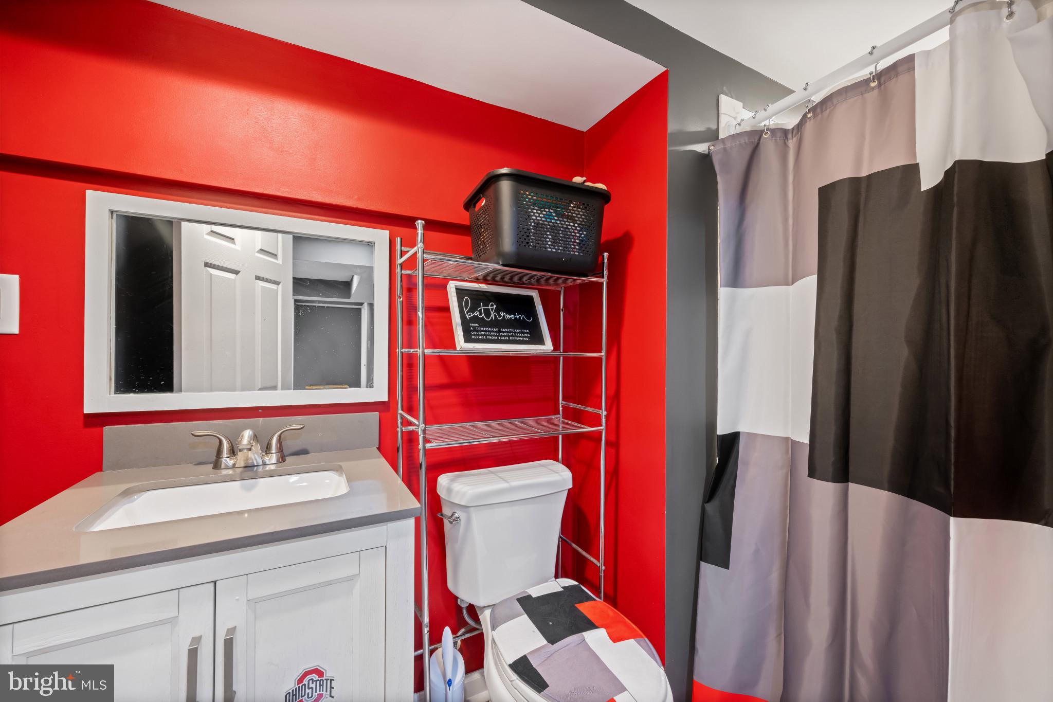 113 West Edgevale Road Baltimore, MD 21225 - Photo 33 of 41 a bathroom with a sink a toilet and shower