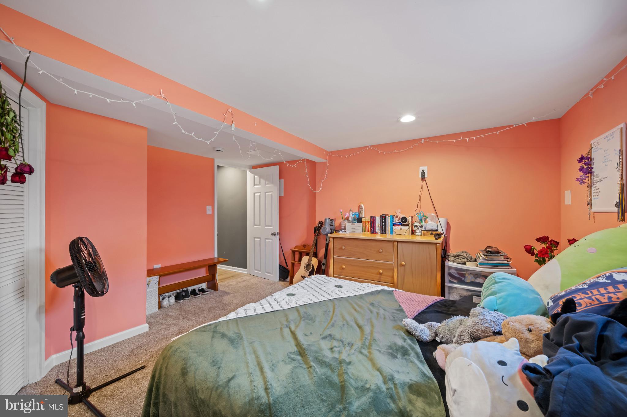 113 West Edgevale Road Baltimore, MD 21225 - Photo 35 of 41 a bedroom with a bed and a dresser