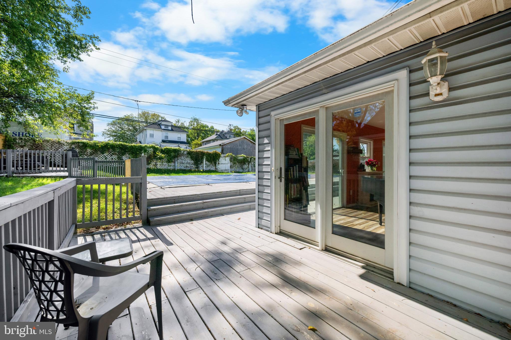 113 West Edgevale Road Baltimore, MD 21225 - Photo 39 of 41 a view of a deck with wooden floor and seating space