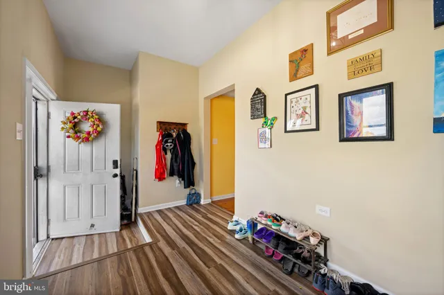 a view of an entryway with wooden floor