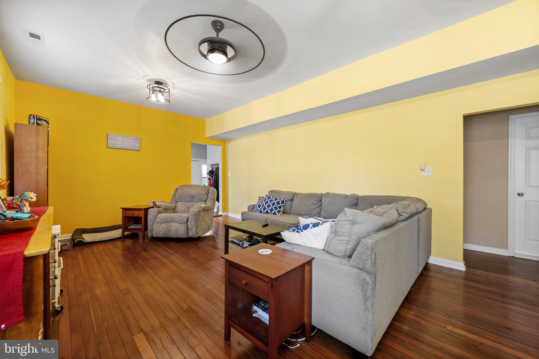 113 West Edgevale Road Baltimore, MD 21225 - Photo 6 of 41 a living room with furniture and a flat screen tv