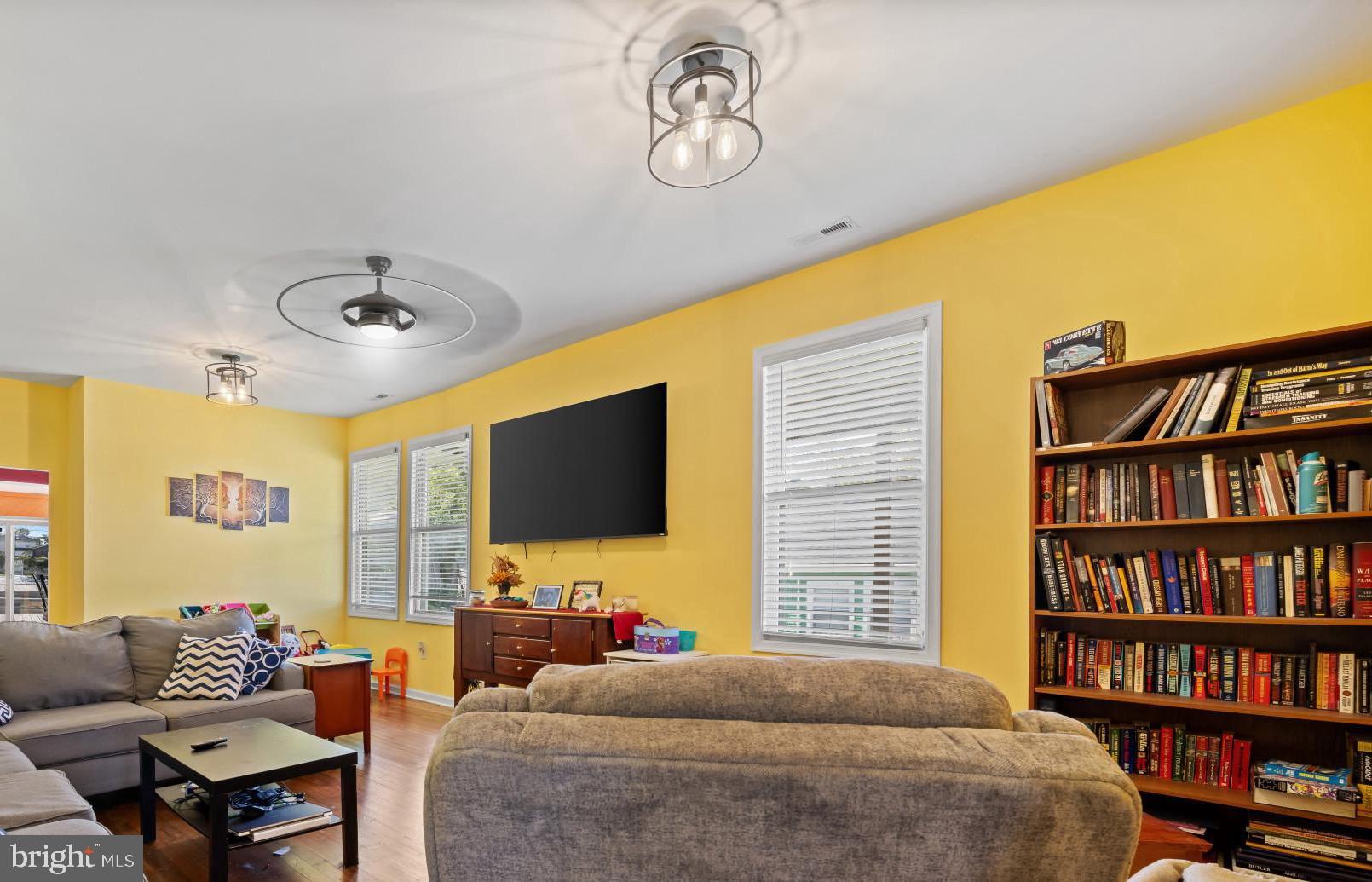 113 West Edgevale Road Baltimore, MD 21225 - Photo 7 of 41 a living room with furniture and a flat screen tv