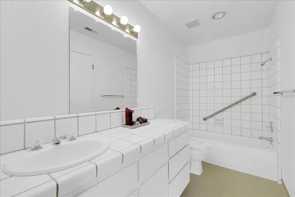 a bathroom with a sink and a bathtub