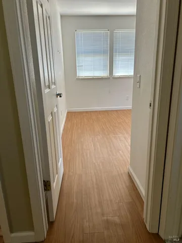 a view of a room with wooden floor and staircase