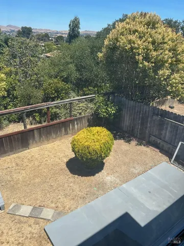 a view of a swimming pool with a yard