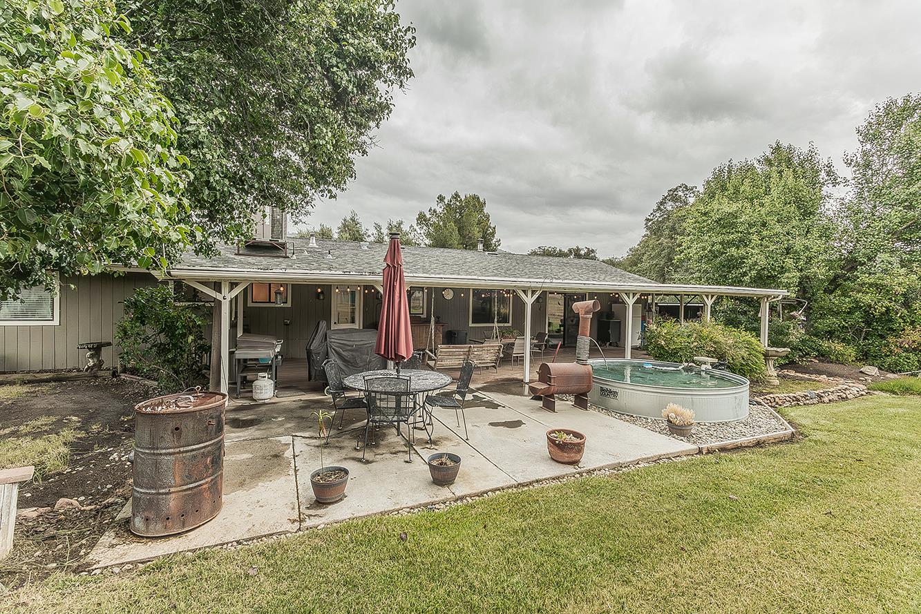 29545 Oak Meadow Road Tollhouse, CA 93667 - Photo 40 of 69 a view of a house with backyard sitting area and garden