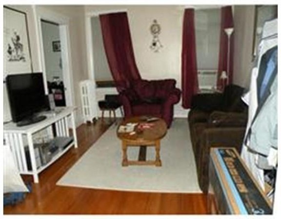 206 Sumner Street, Unit 3 Newton, MA 02459 - Photo 6 of 8 a living room with furniture and a flat screen tv