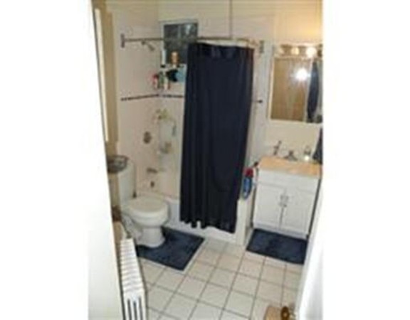 206 Sumner Street, Unit 3 Newton, MA 02459 - Photo 7 of 8 a bathroom with a sink and a toilet