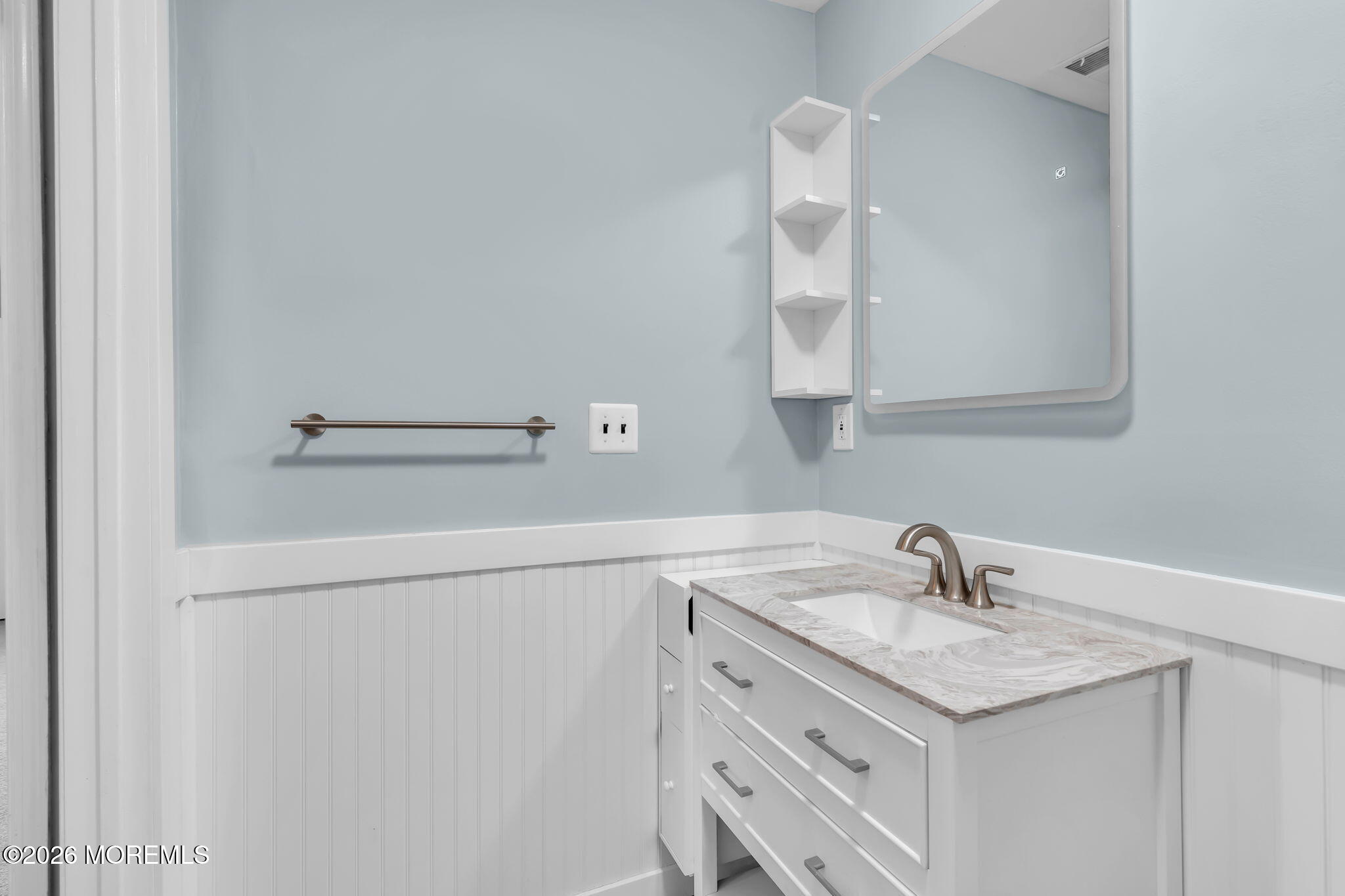 106 Frontier Way Tinton Falls, NJ 07753 - Photo 11 of 22 a bathroom with a sink and a mirror