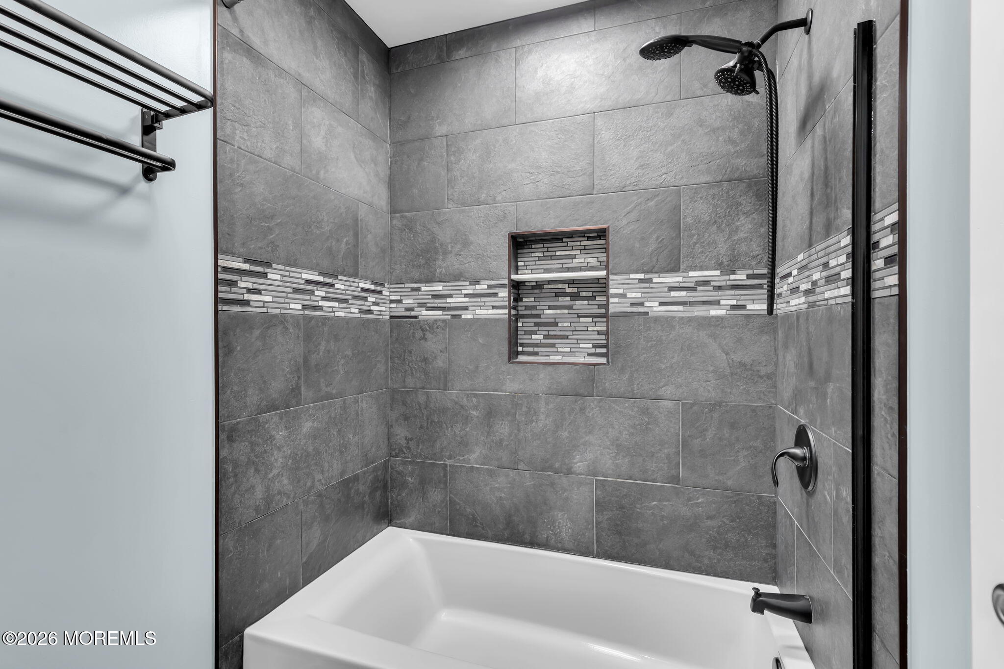 106 Frontier Way Tinton Falls, NJ 07753 - Photo 14 of 22 a bath tub sitting next to a white sink and vanity