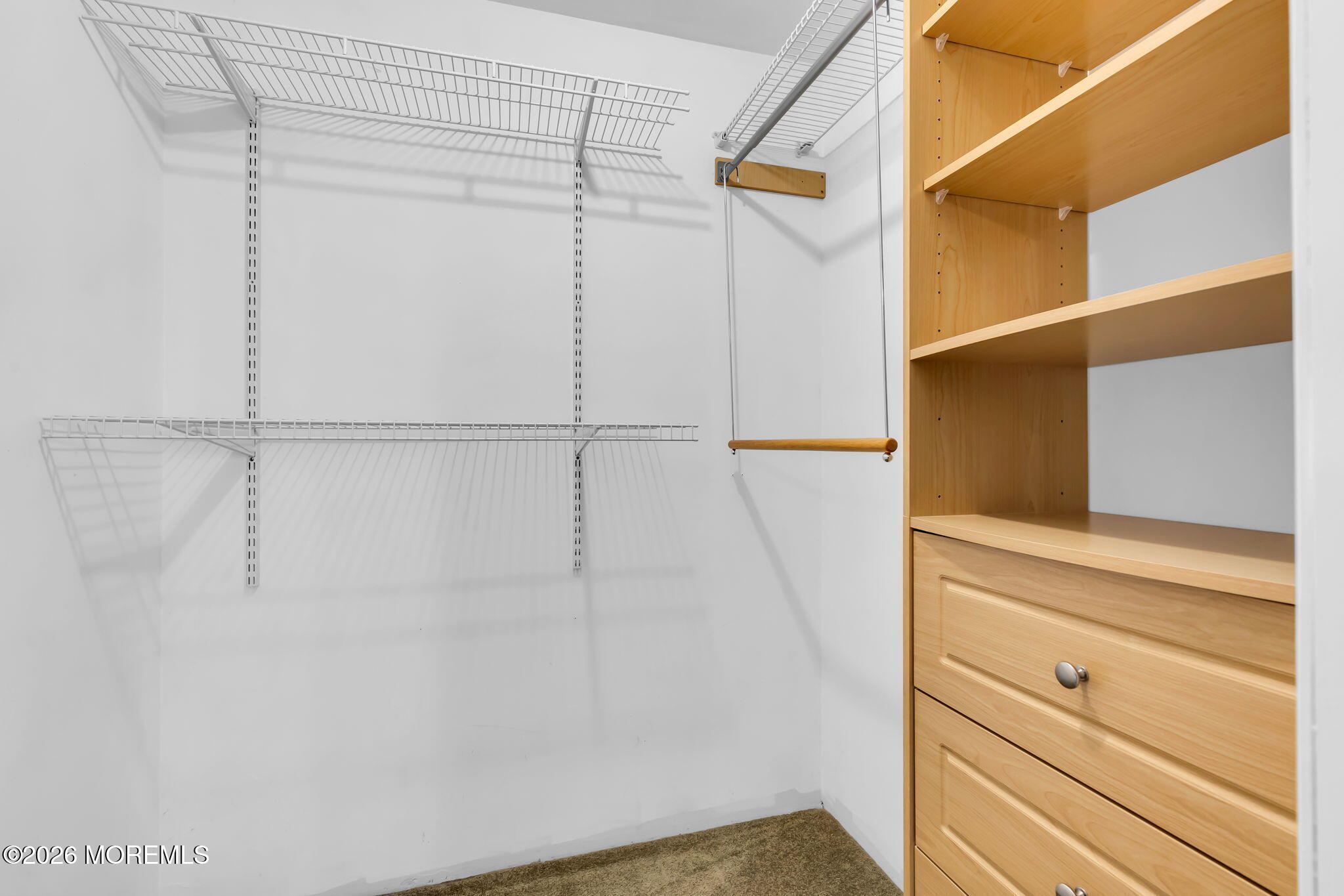 106 Frontier Way Tinton Falls, NJ 07753 - Photo 19 of 22 a view of walk in closet with empty racks