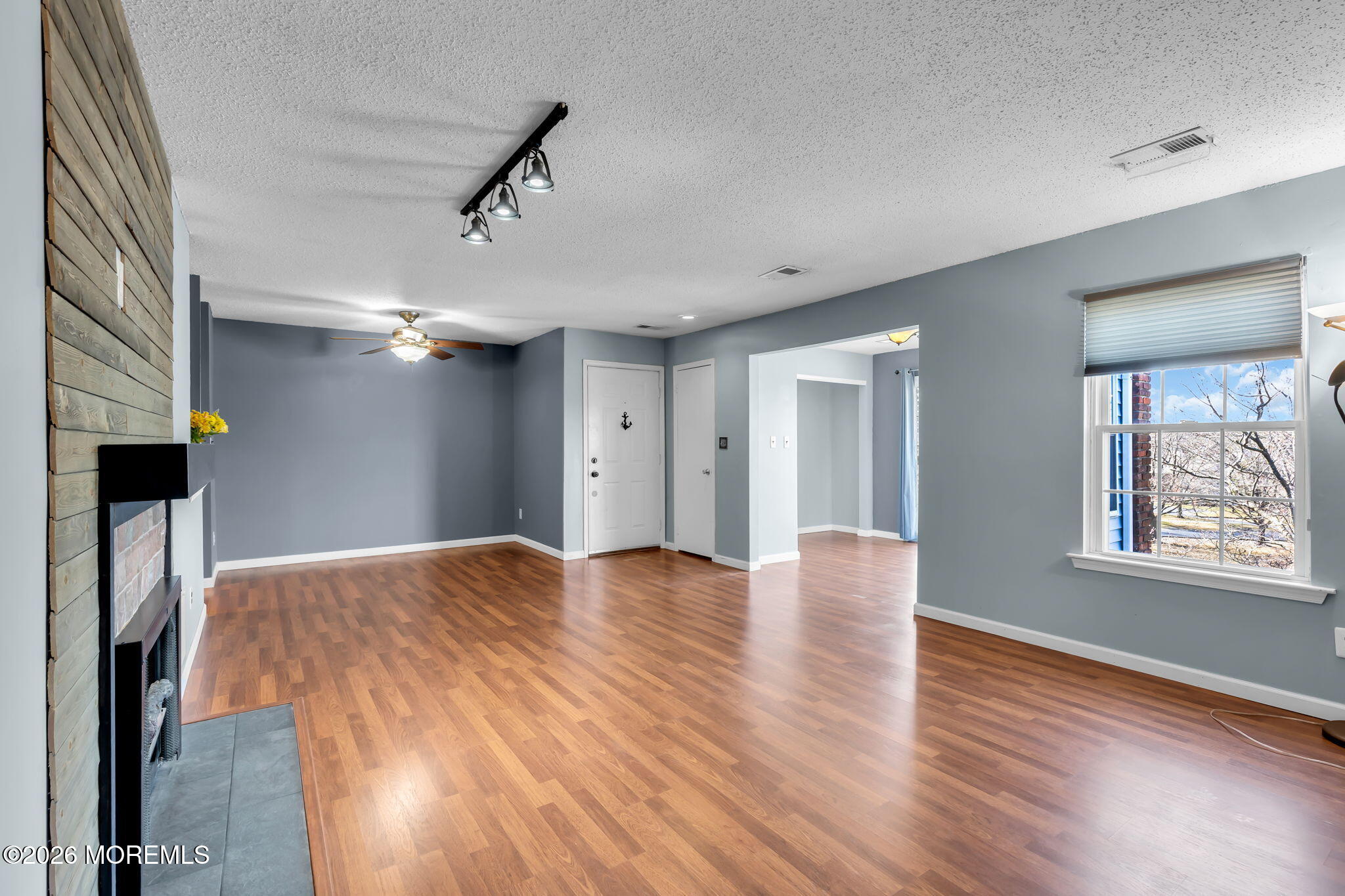 106 Frontier Way Tinton Falls, NJ 07753 - Photo 4 of 22 a view of livingroom with hardwood floor and hallway