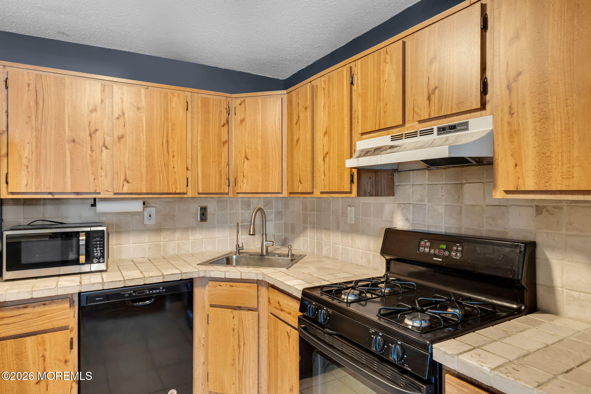 106 Frontier Way Tinton Falls, NJ 07753 - Photo 9 of 22 a kitchen with stainless steel appliances granite countertop a stove a sink dishwasher and a microwave