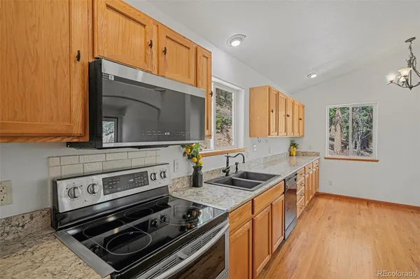 a kitchen with a stove and a microwave