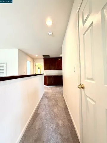 a view of a hallway with a large window