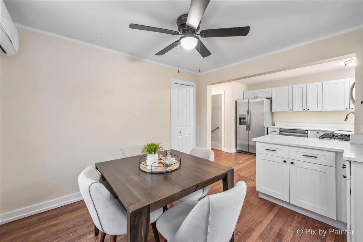 712 South 5th Street St. Charles, IL 60174 - Photo 13 of 25 a view of a dining room with furniture and wooden floor