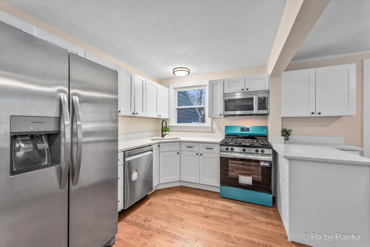 712 South 5th Street St. Charles, IL 60174 - Photo 9 of 25 a kitchen with stainless steel appliances granite countertop a refrigerator a stove top oven a sink and dishwasher