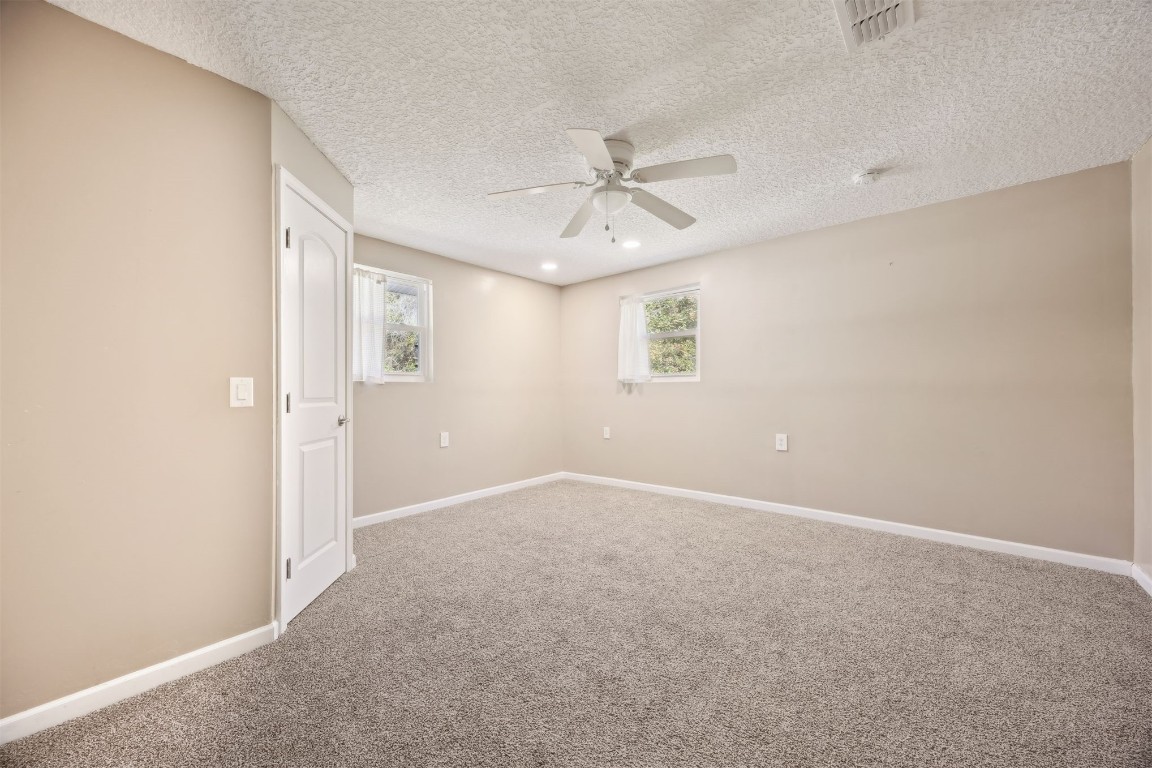 87529 Roses Bluff Road Yulee, FL 32097 - Photo 22 of 38 a view of an empty room with a window