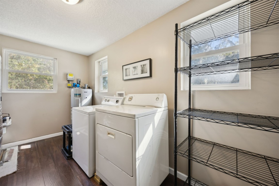 87529 Roses Bluff Road Yulee, FL 32097 - Photo 24 of 38 a utility room with dryer and washer
