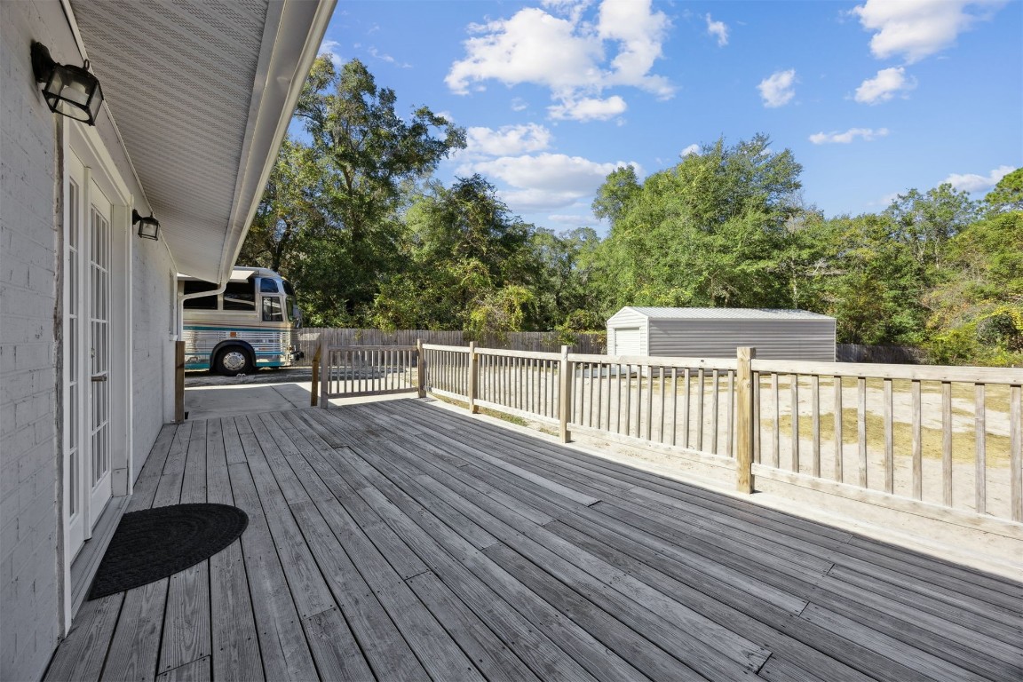 87529 Roses Bluff Road Yulee, FL 32097 - Photo 26 of 38 a view of deck and hall with wooden floor