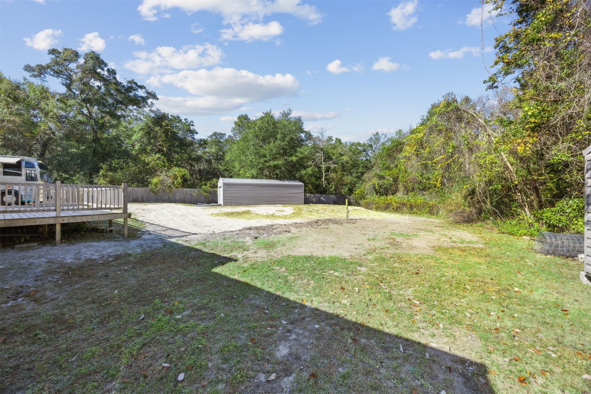 87529 Roses Bluff Road Yulee, FL 32097 - Photo 28 of 38 a view of a backyard with swimming pool
