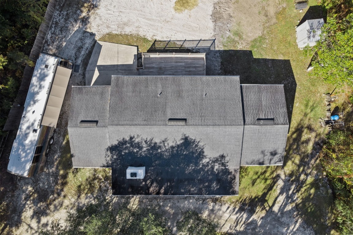 87529 Roses Bluff Road Yulee, FL 32097 - Photo 30 of 38 an aerial view of a house with a yard