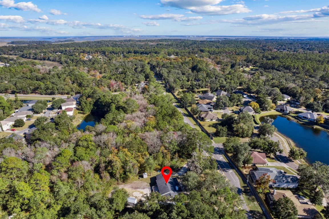 87529 Roses Bluff Road Yulee, FL 32097 - Photo 36 of 38 an aerial view of multiple house