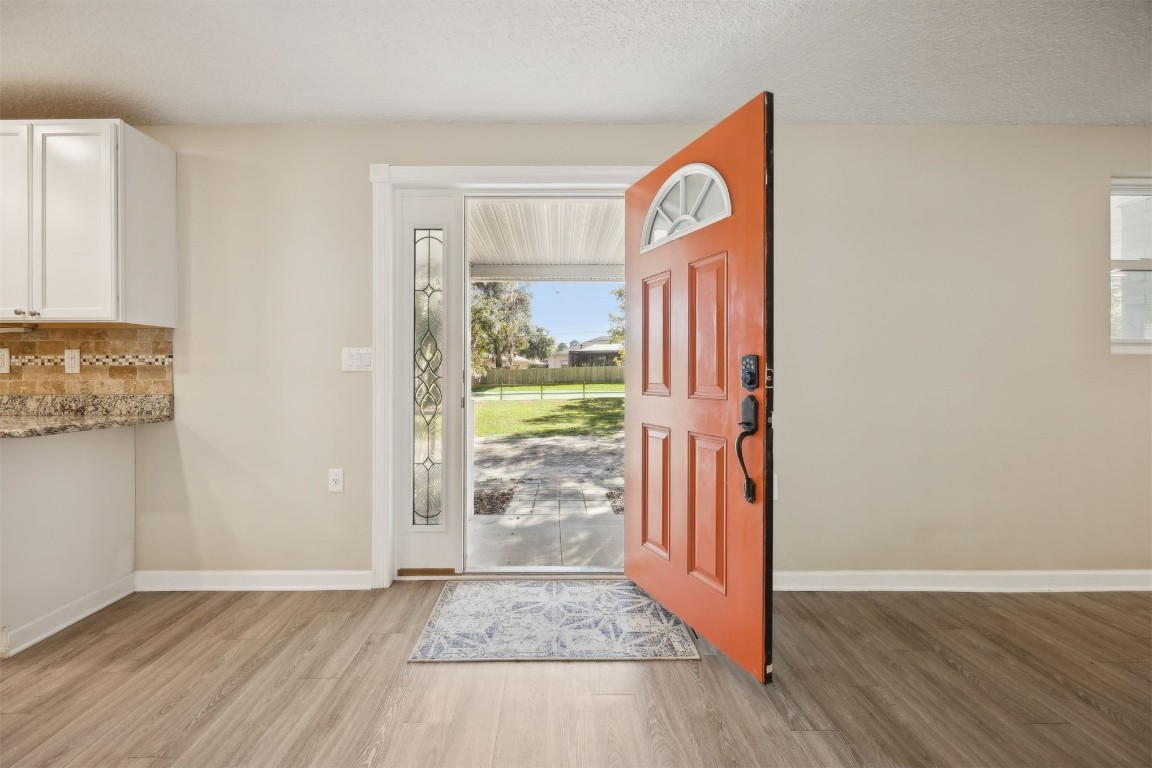 87529 Roses Bluff Road Yulee, FL 32097 - Photo 6 of 38 a view of an entryway with wooden floor