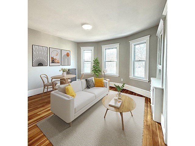 69 Conwell Avenue, Unit 2 Somerville, MA 02144 - Photo 3 of 14 a living room with furniture and a large window