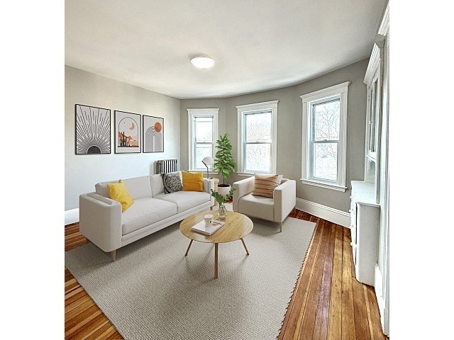 69 Conwell Avenue, Unit 2 Somerville, MA 02144 - Photo 4 of 14 a living room with furniture and a large window