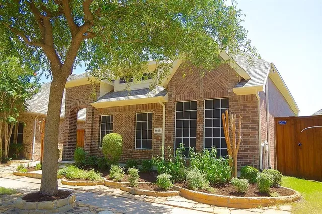 a view of an empty room with window and a bathroom