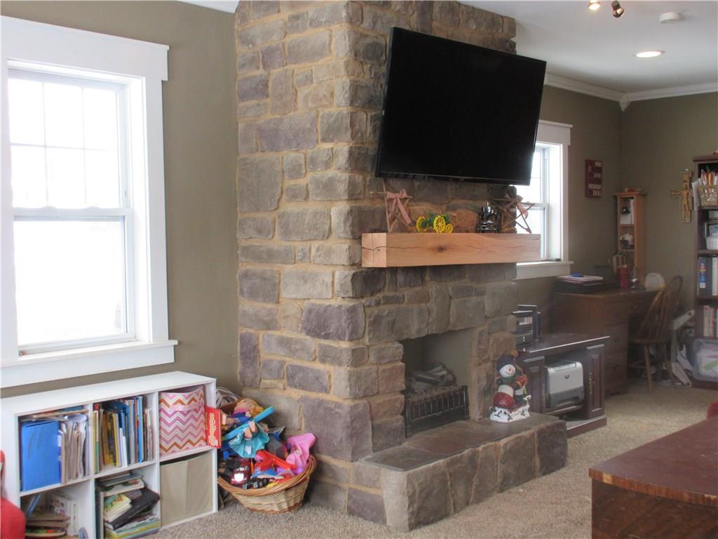 744 Winfield Road Cabot, PA 16023 - Photo 3 of 23 Stone fireplace in living room