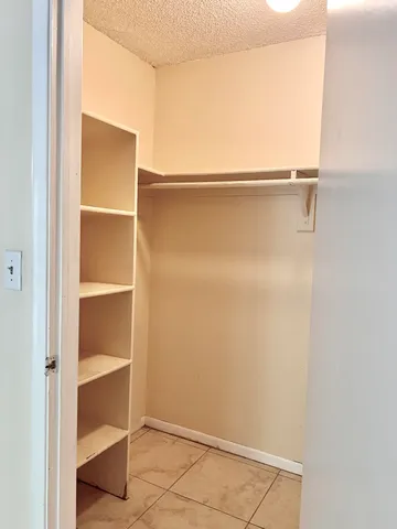 a view of an empty walk in closet