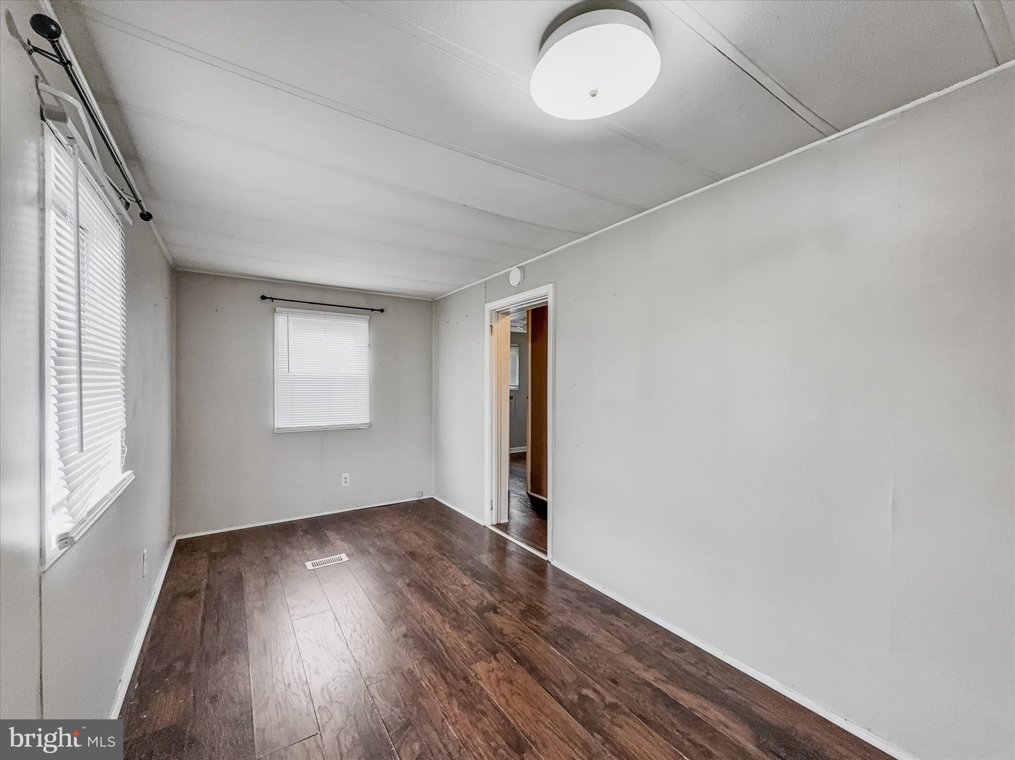 3720 Davidsburg Road, Unit C7 Dover, PA 17315 - Photo 13 of 20 an empty room with wooden floor and windows