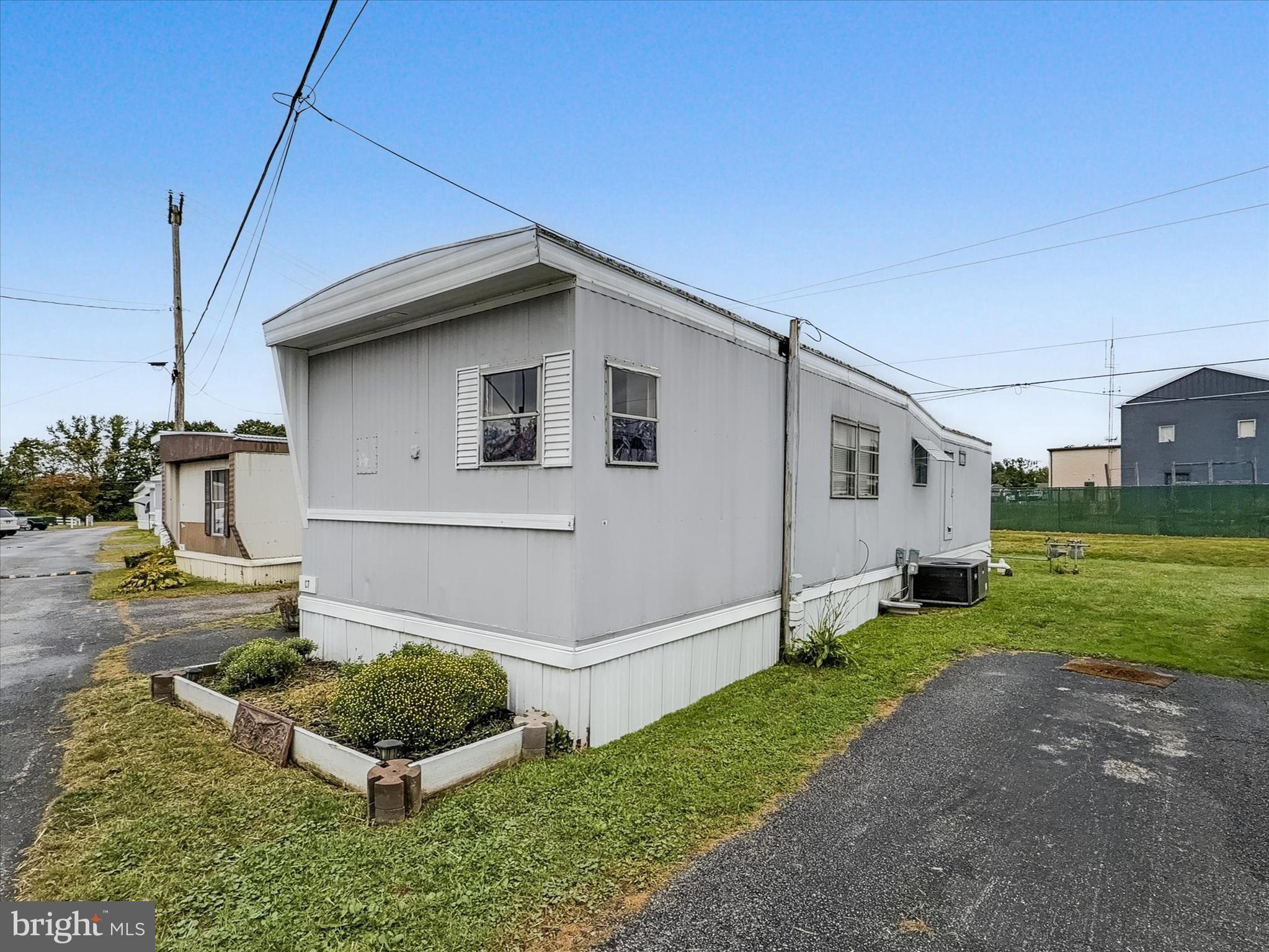 3720 Davidsburg Road, Unit C7 Dover, PA 17315 - Photo 3 of 20 a house view with a garden space