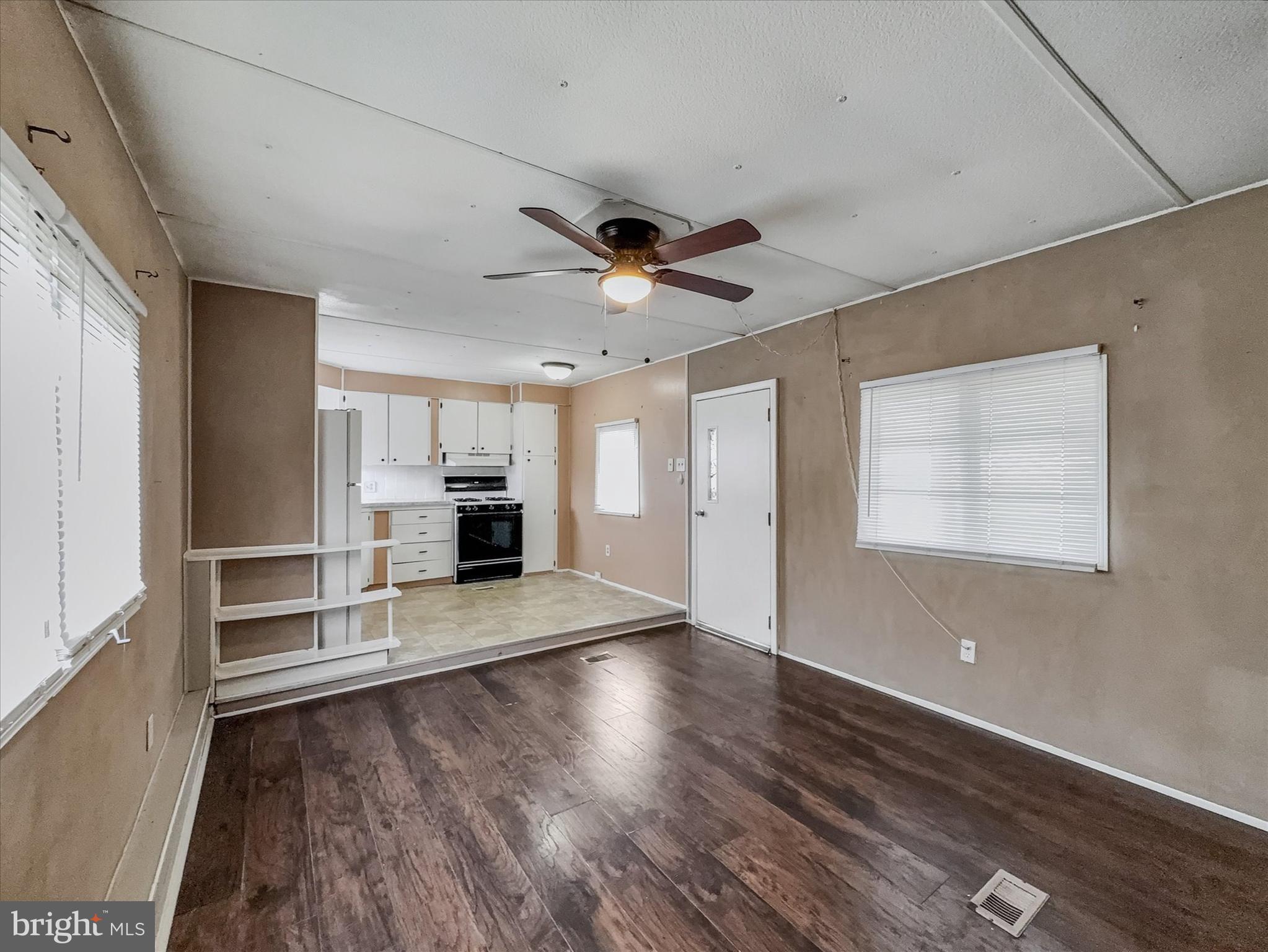 3720 Davidsburg Road, Unit C7 Dover, PA 17315 - Photo 6 of 20 an empty room with wooden floor and windows
