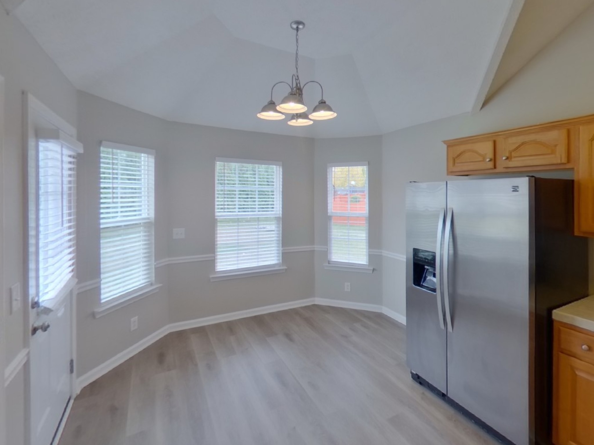 1429 Factors Walk Murfreesboro, TN 37128 - Photo 3 of 17 a view of a room with wooden floor stainless steel appliances and windows