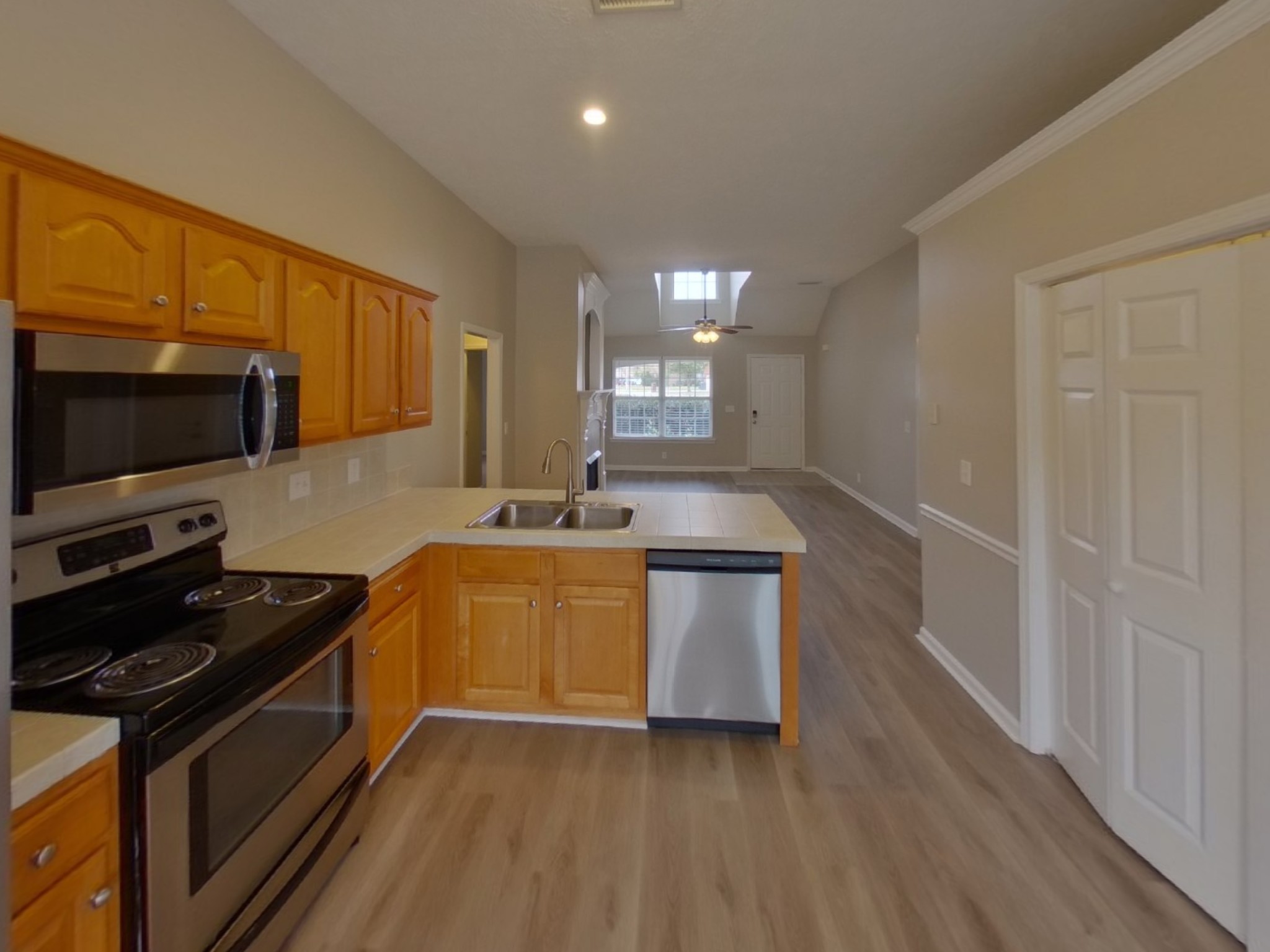 1429 Factors Walk Murfreesboro, TN 37128 - Photo 4 of 17 a kitchen with stainless steel appliances a sink stove and microwave