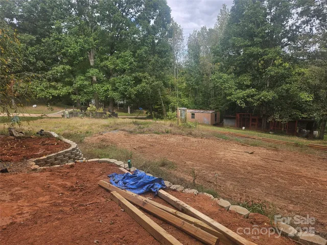 a view of a backyard with of trees