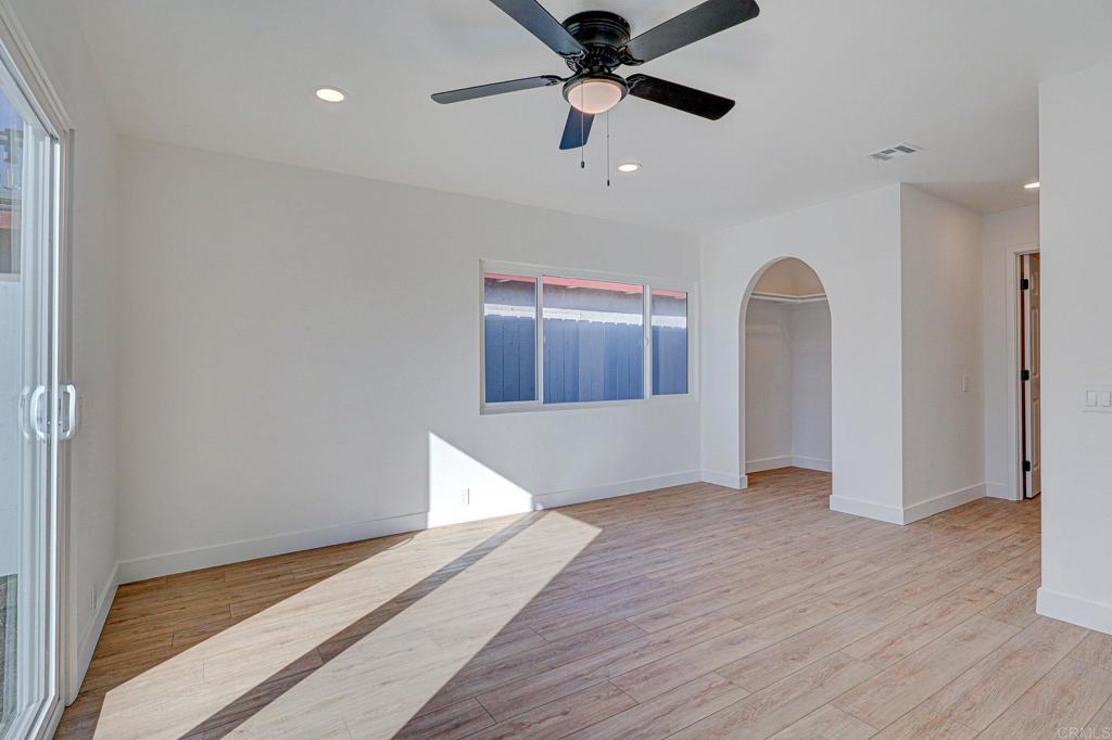 4205 Rene Drive San Diego, CA 92154 - Photo 14 of 24 wooden floor in an empty room with a window