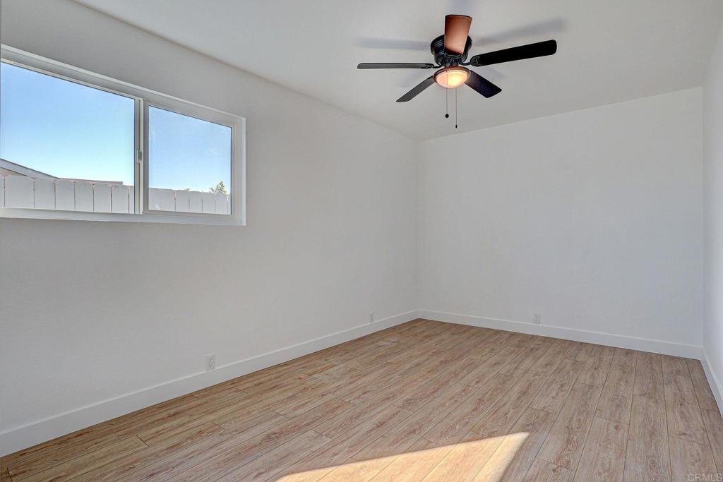 4205 Rene Drive San Diego, CA 92154 - Photo 20 of 24 wooden floor in an empty room with a window
