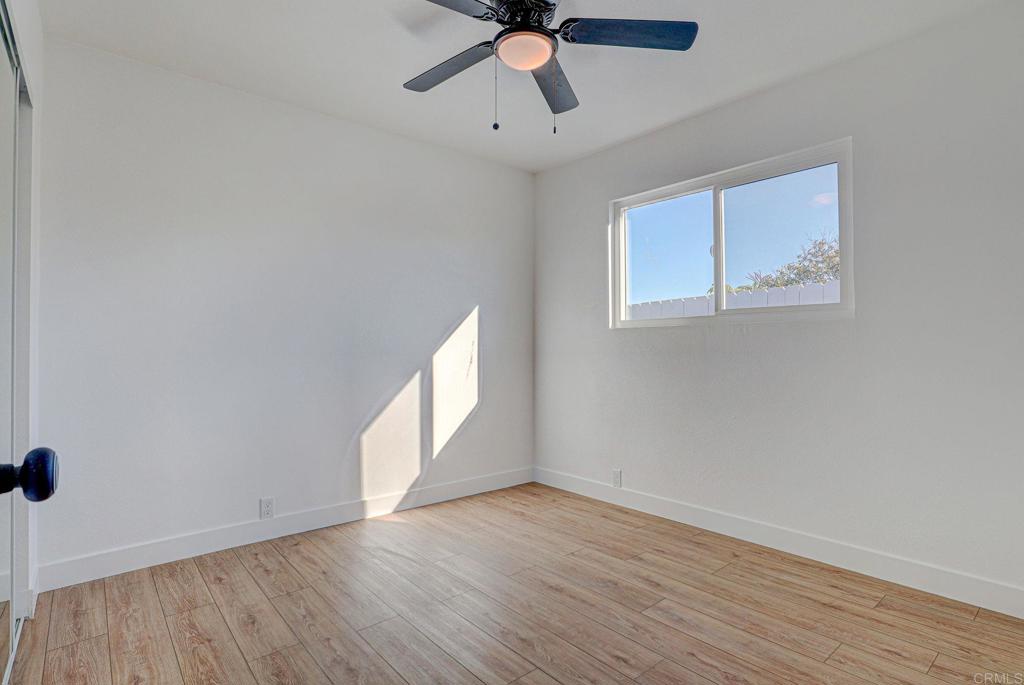 4205 Rene Drive San Diego, CA 92154 - Photo 21 of 24 wooden floor in an empty room with a window