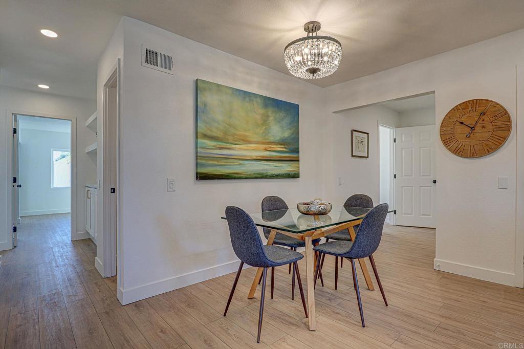 4205 Rene Drive San Diego, CA 92154 - Photo 9 of 24 a view of a dining room with furniture and wooden floor