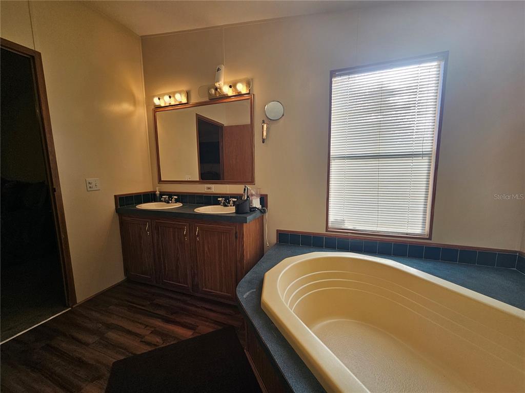 14381 Camp Mack Road Lake Wales, FL 33898 - Photo 17 of 52 a bathroom with a bathtub and a window