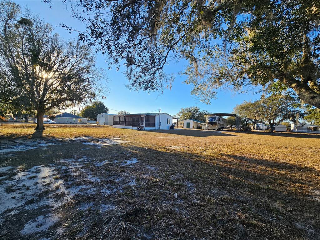 14381 Camp Mack Road Lake Wales, FL 33898 - Photo 2 of 52 a view of yard with swimming pool and green space