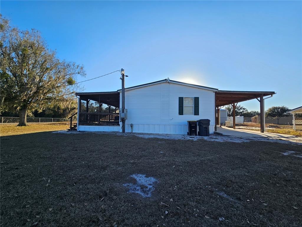 14381 Camp Mack Road Lake Wales, FL 33898 - Photo 35 of 52 a view of a house with backyard and a garden