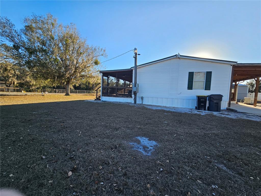 14381 Camp Mack Road Lake Wales, FL 33898 - Photo 36 of 52 a view of a house with backyard and trees